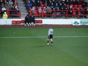 The TRFC keeper slowly walks off the field because he's too injured to carry on