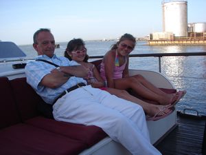 Reg, Izzy, & Litty on the boat (just leaving Banjul  port)